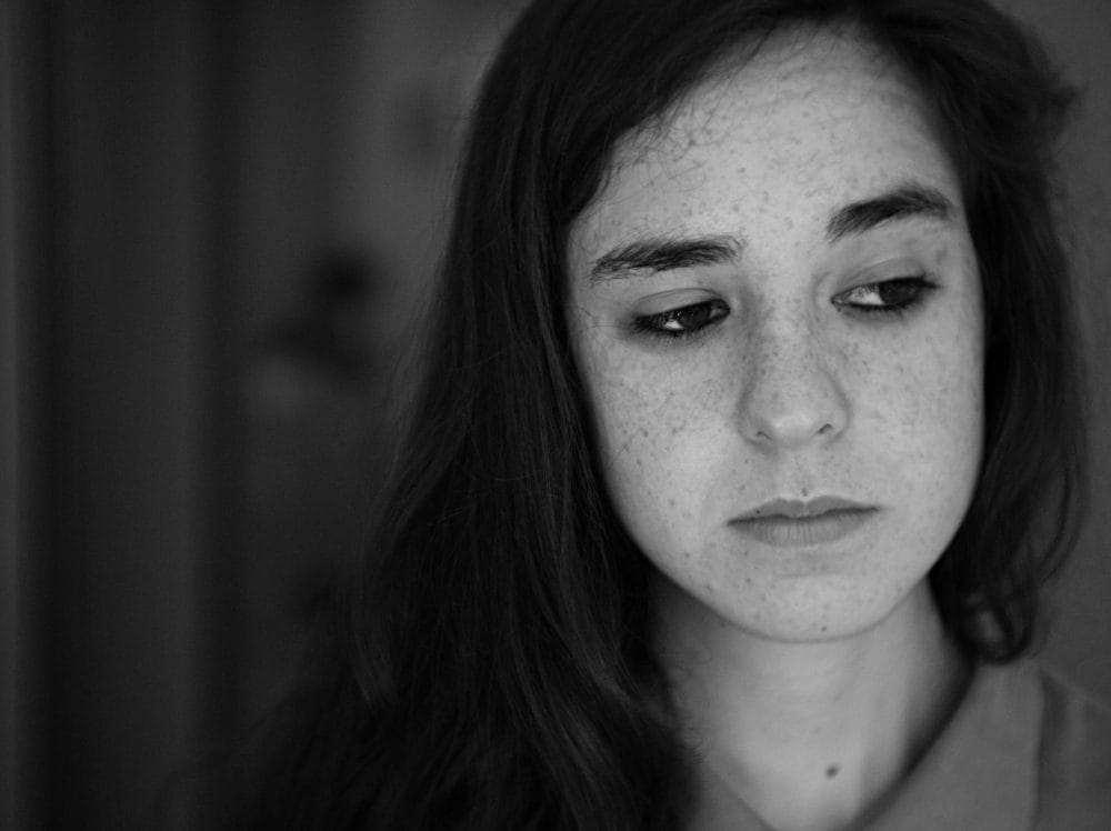 black and white teen girl looking to the side