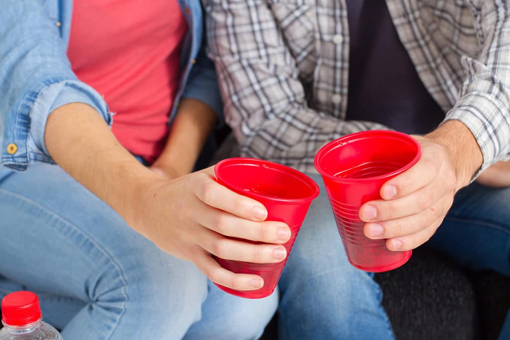 what is lean, two red plastic cups being cheered